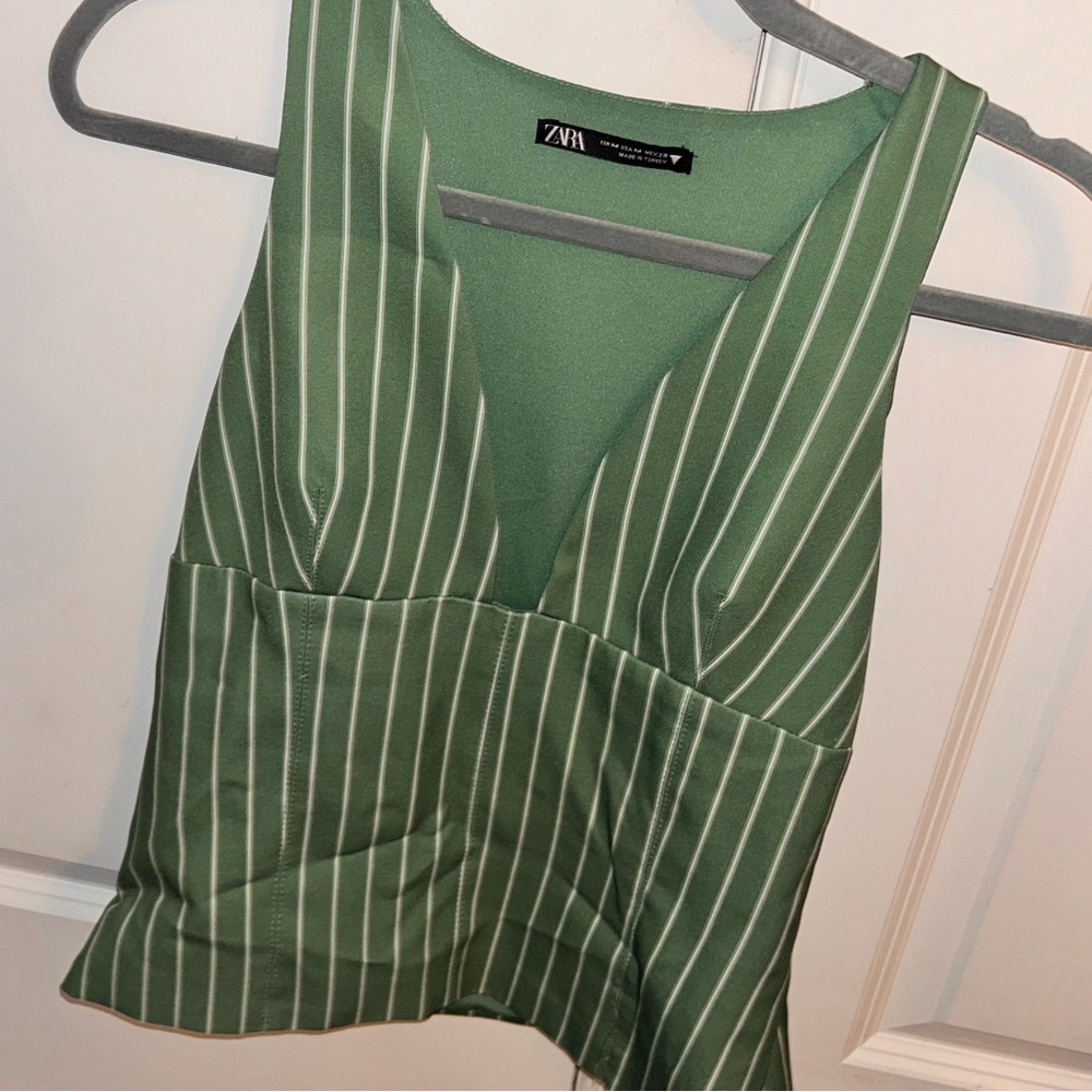Worn once green and white striped tank top! Very cute and flattering.